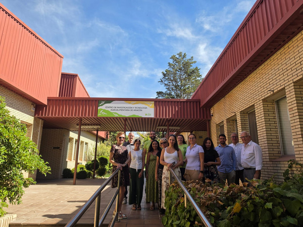 Group of people standing in front of a building.