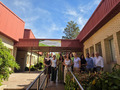 Group of people standing in front of a building.